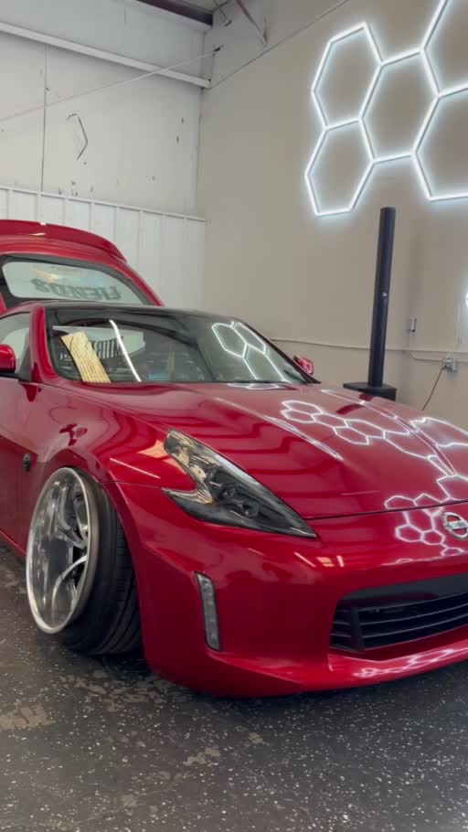 Paint protection film work on a red 370Z